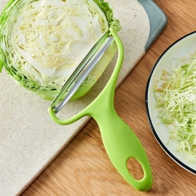 epluche-legume-vert-plastique