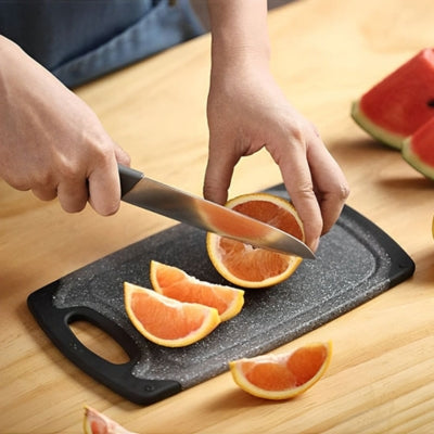 planche-a-decouper-orange-coupee