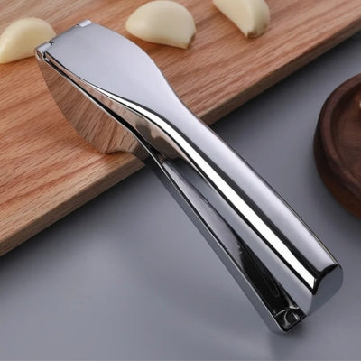 presse-ail-inox-miroir-planche-bois